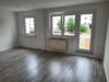 3-Zimmer Wohnung mit Balkon - Muster-Wohnzimmer